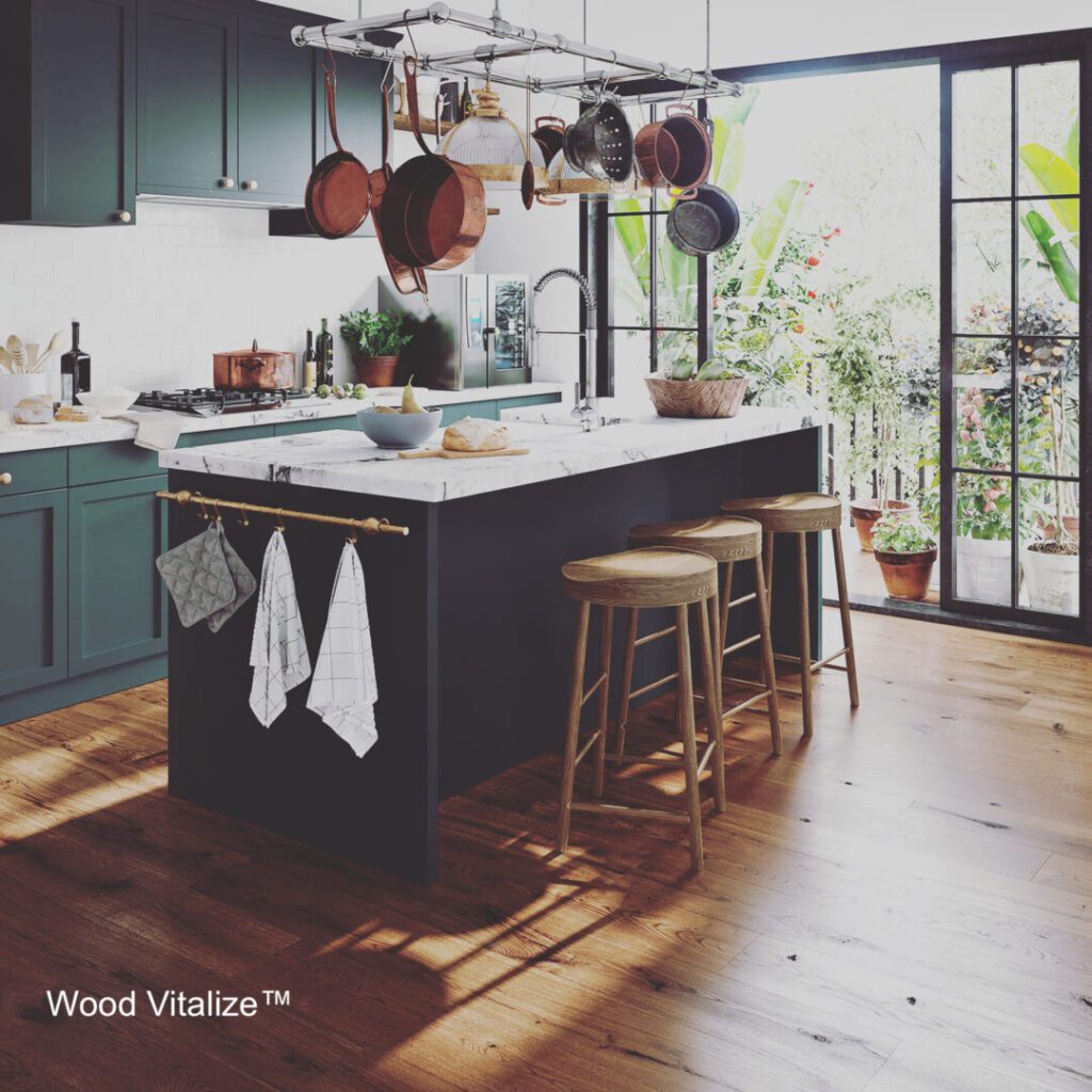Modern kitchen with island and hanging pots.