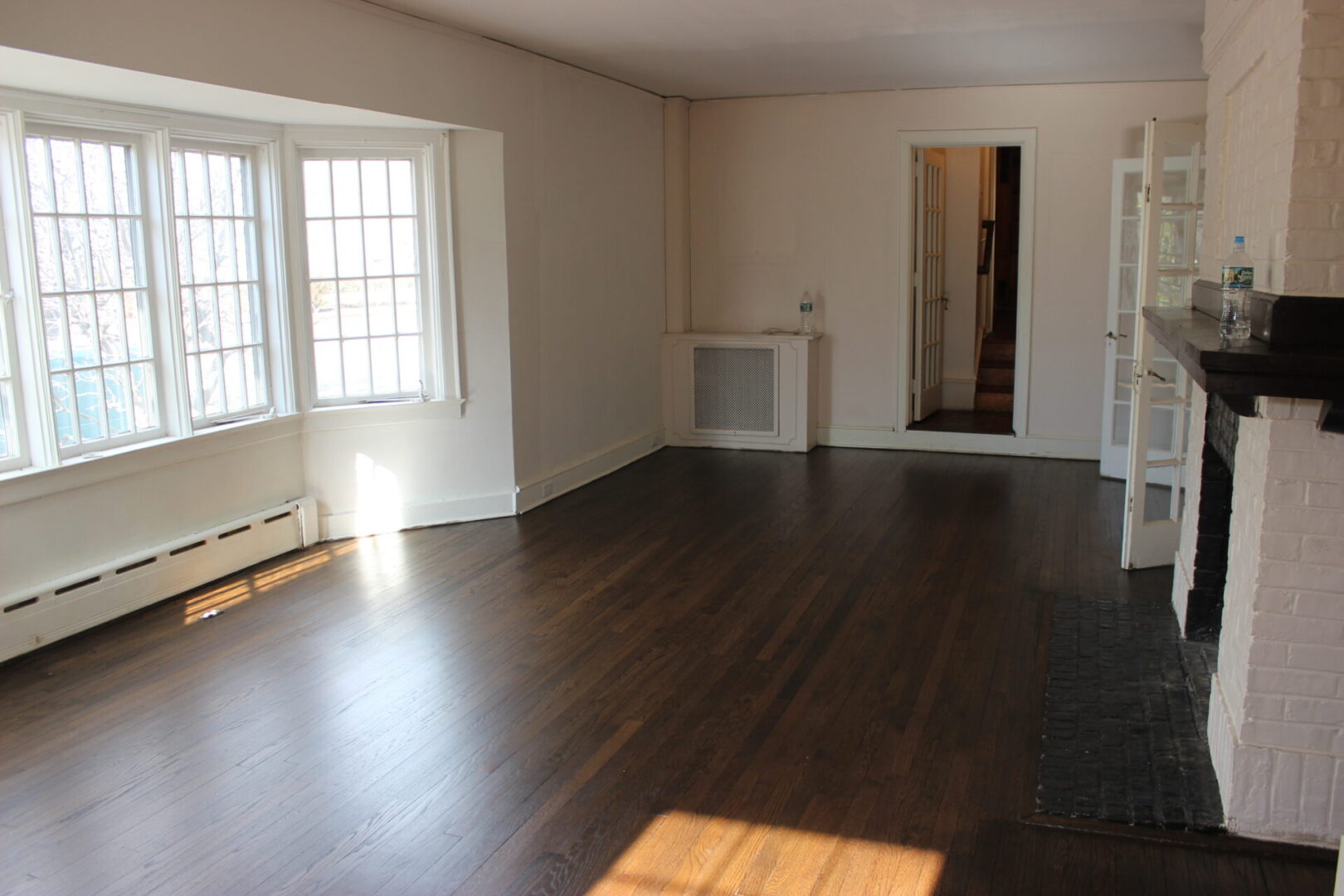 Hardwood floor installation in Queens NY showing new wood flooring being installed