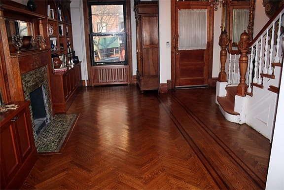 restored herringbone hardwood floor after cleaning dustless sanding and recoating in Forest Hills Queens
