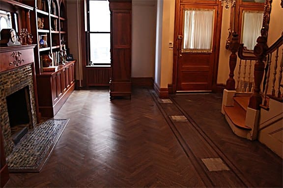 dull herringbone hardwood floor before cleaning and dustless sanding in Forest Hills Queens