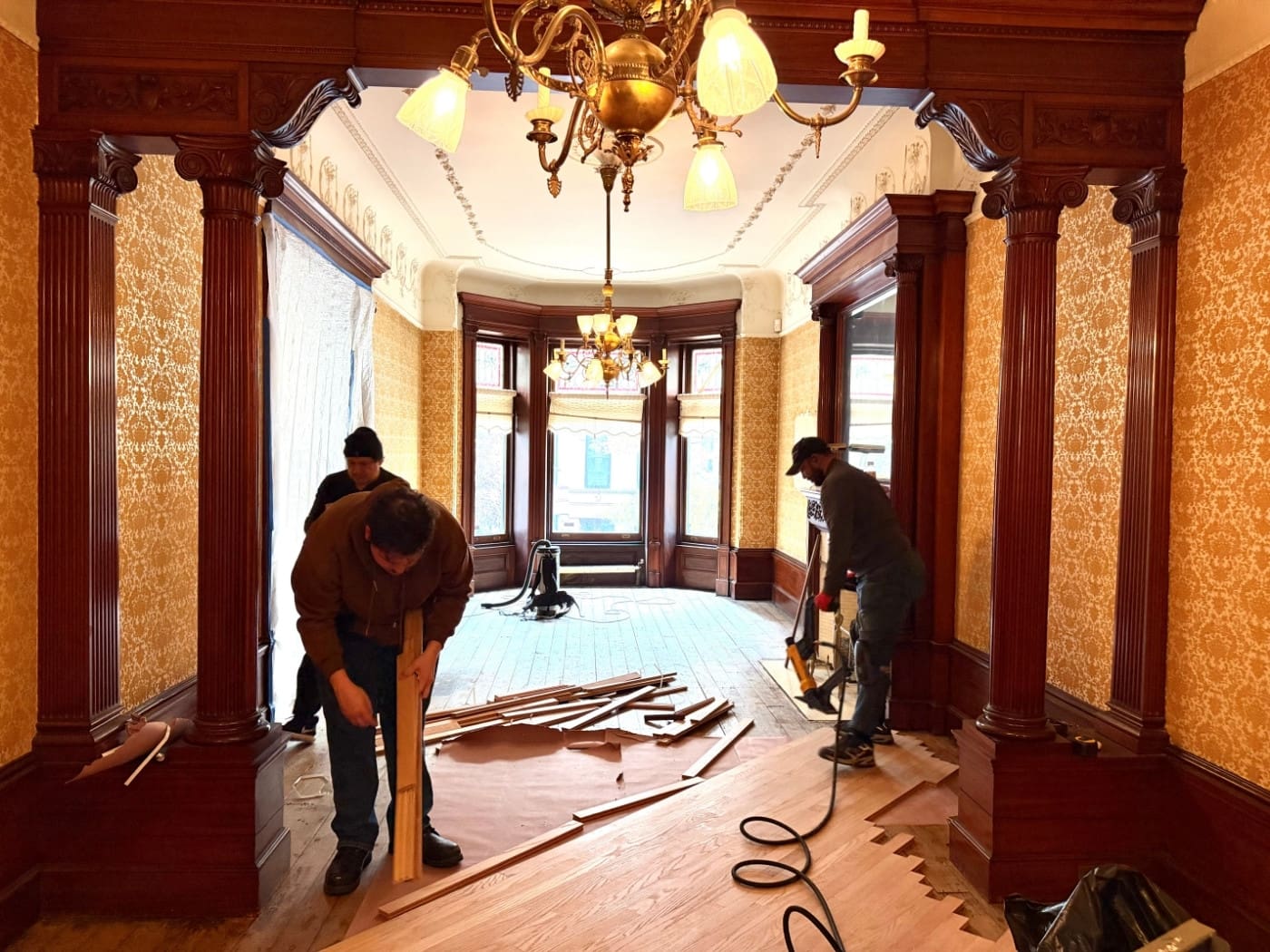 existing hardwood floor before new installation in Rye NY showing worn surface and outdated finish