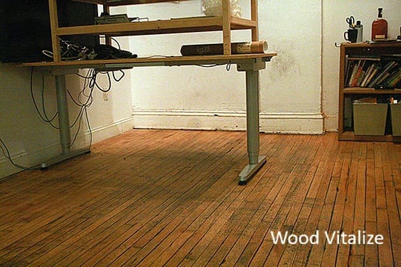 dirty hardwood floors under desk before cleaning around furniture commercial office nyc