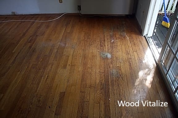 Dark worn hardwood floors before sanding and refinishing in Whitestone Queens NY
