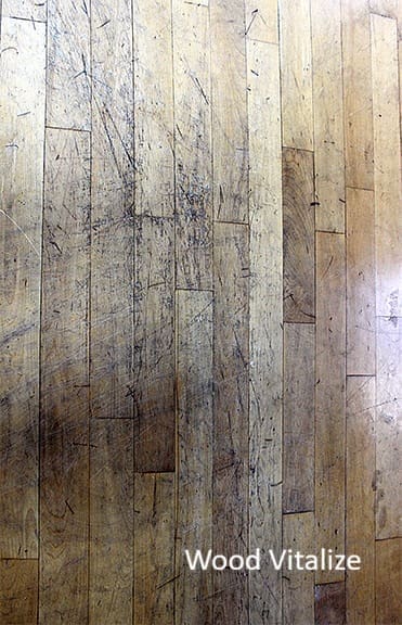 Close up of scratched hardwood floor before dustless sanding in Brooklyn Heights NY