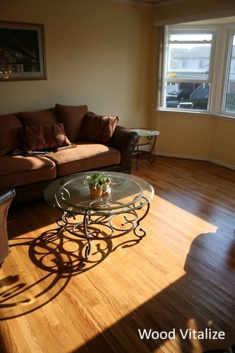 Refinished hardwood floors with furniture in Carroll Gardens Brooklyn brownstone using dustless sanding and UV cure polyurethane