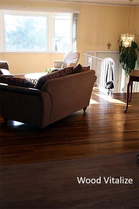 In-process hardwood floor refinishing with furniture still inside the home in Carroll Gardens Brooklyn