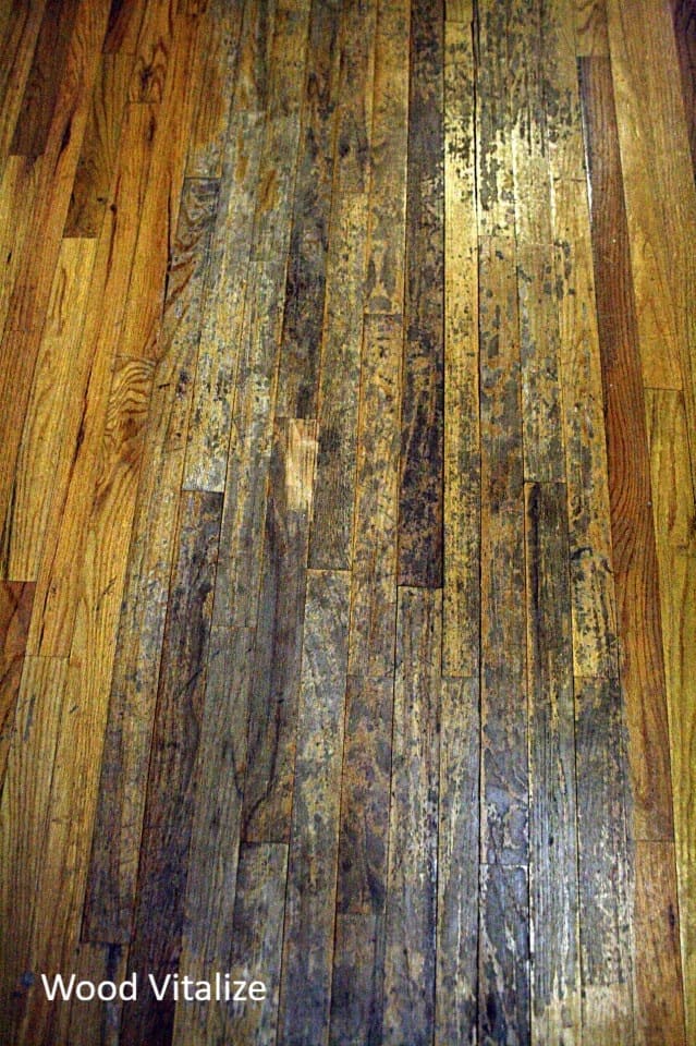 Close up of damaged hardwood floor before spot refinishing in Manhattan