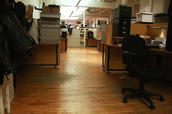 Before dustless hardwood floor refinishing in DUMBO Brooklyn commercial office
