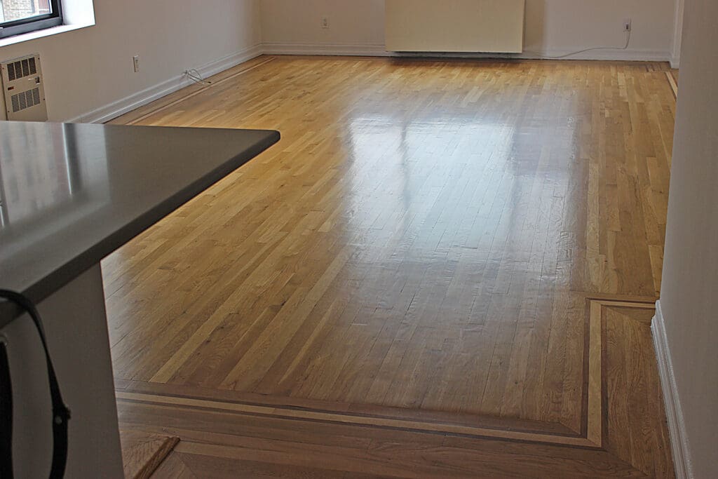 After hardwood floor cleaning in Manhattan apartment by Wood Vitalize showing cleaner and brighter wood floors.