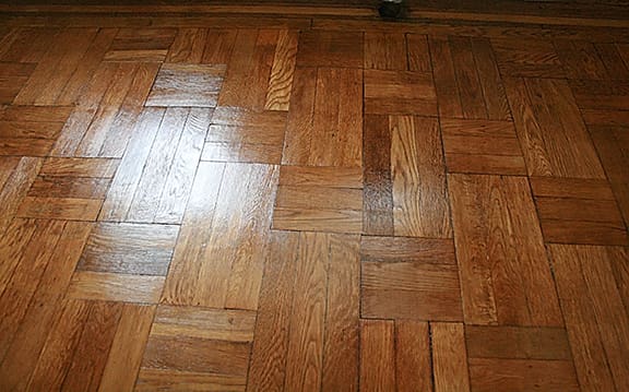After hardwood floor cleaning in Manhattan showing removal of heavy dirt and grime buildup by Wood Vitalize