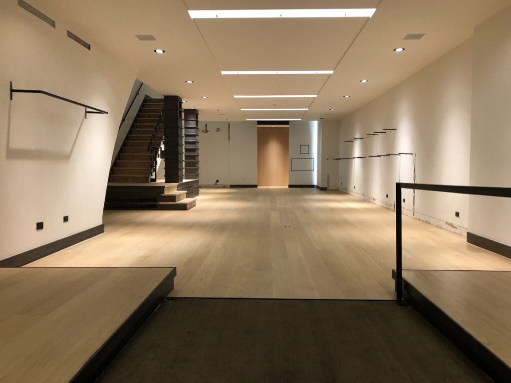 After retail hardwood floor refinishing on 5th Ave with UV instant cure polyurethane